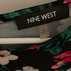 Black dress with multi-colored flowers. Runs big.